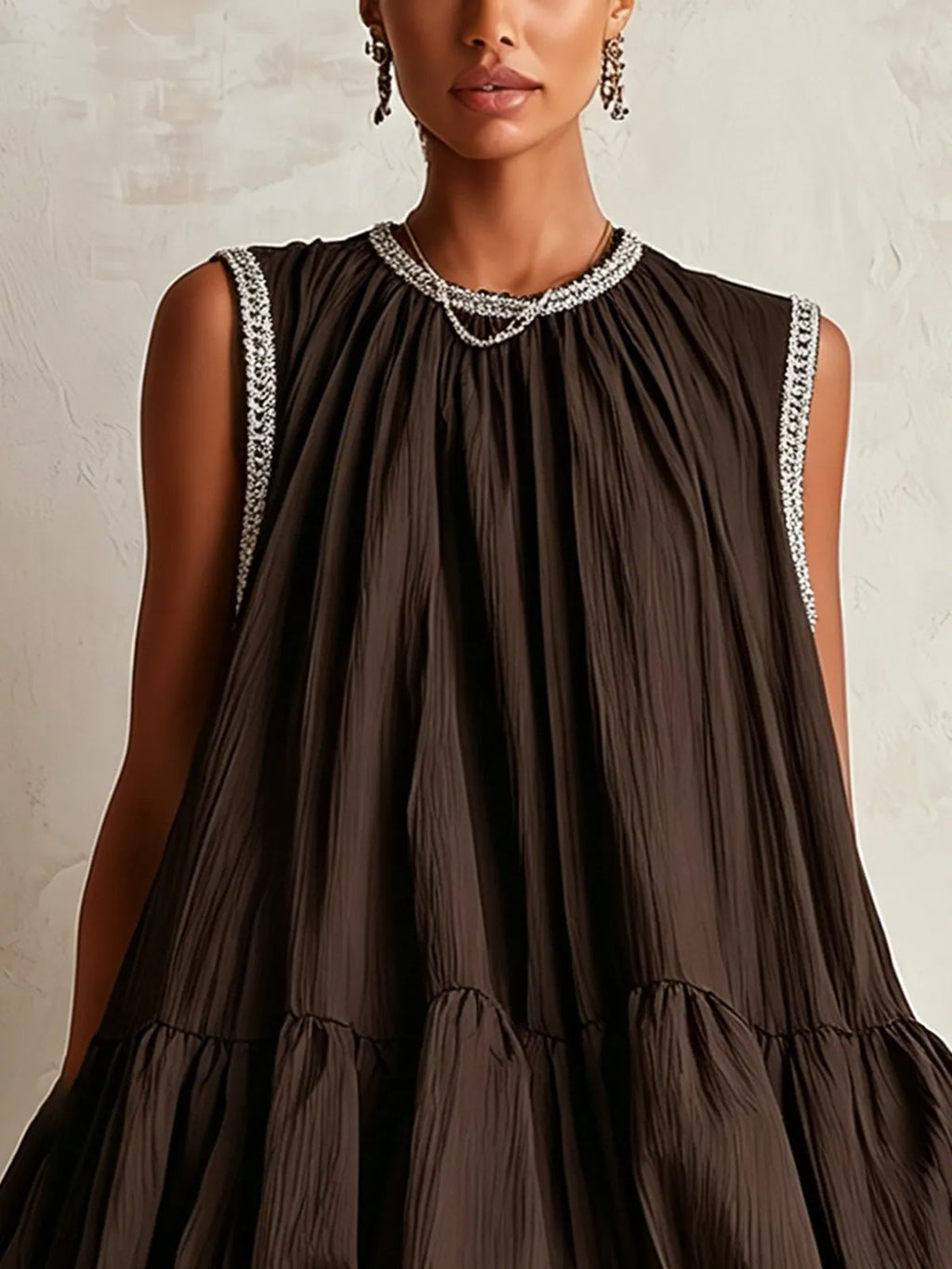 Brown sleeveless mini dress with a bubble hem