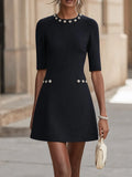 Dark blue A-line mini dress with a round neck and floral embellishment